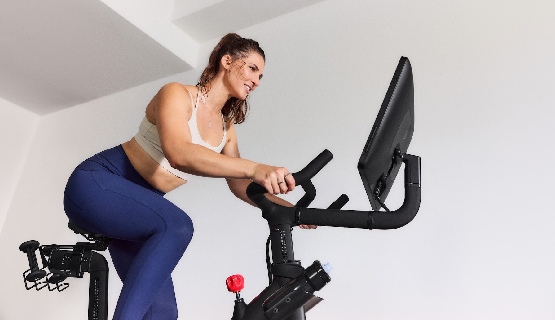 Woman on Peloton Bike