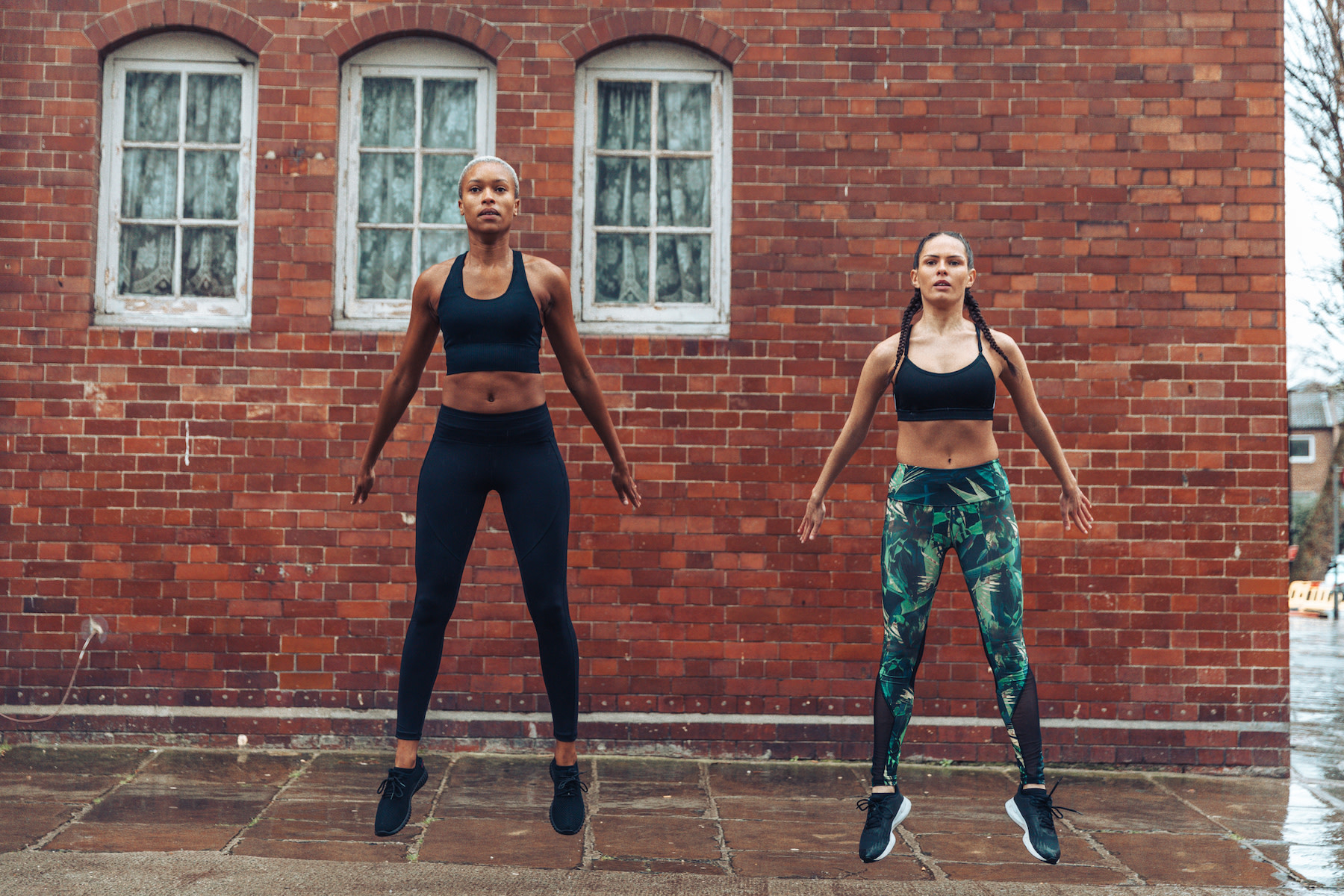 women doing squat jumps