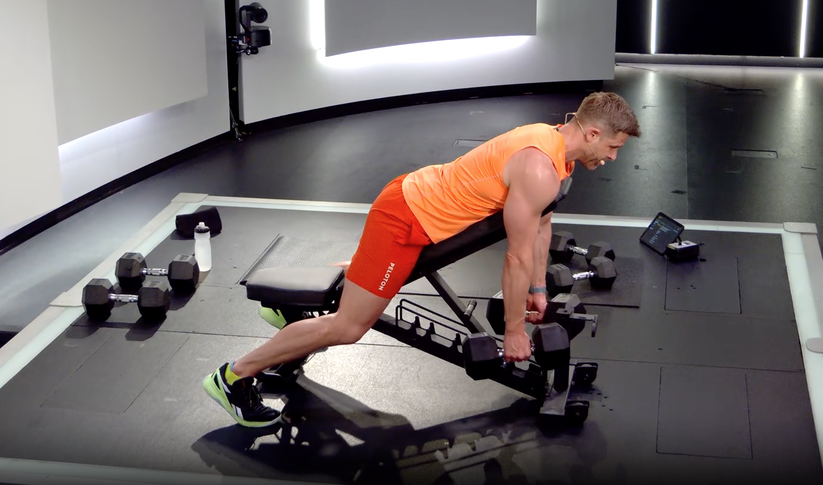 Andy Speer demonstrates a chest-supported row exercise in a Peloton class