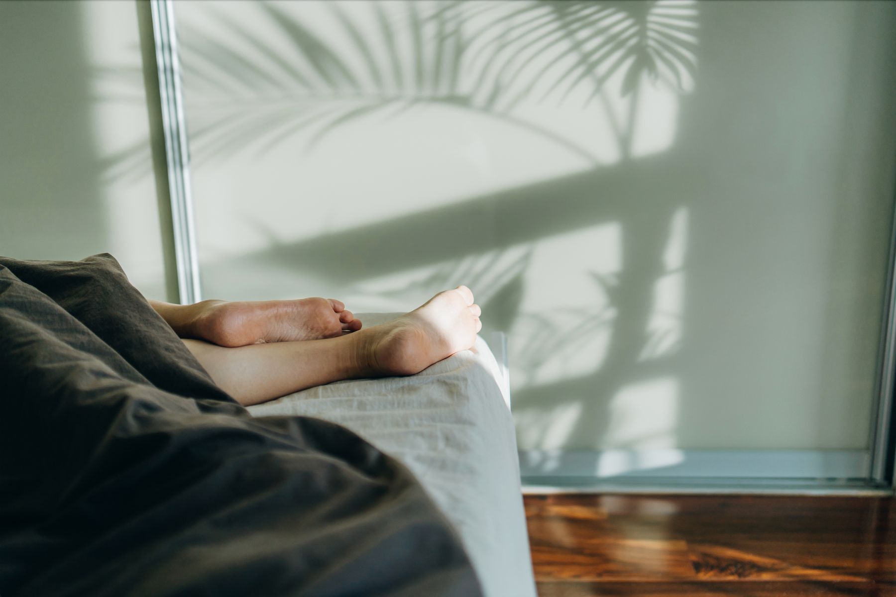 Is It Safe to Sit on Your Bed Wearing Outside Clothes? Experts