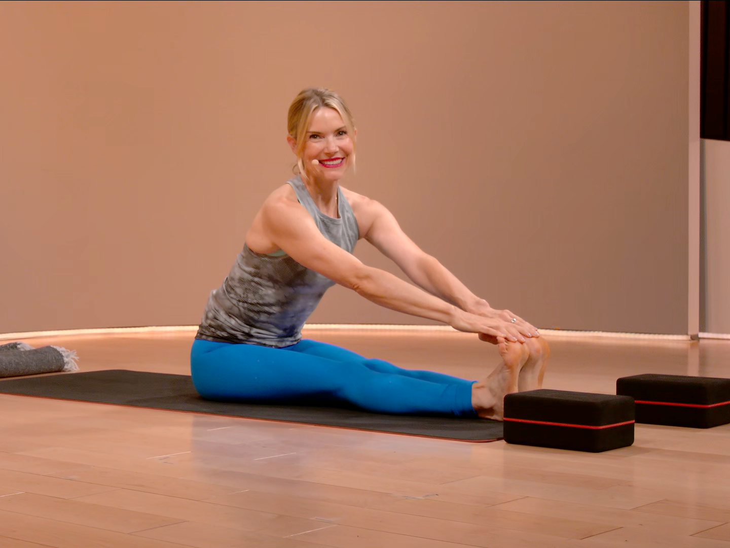 Kristin McGee in Yoga Class, Stretching on Mat