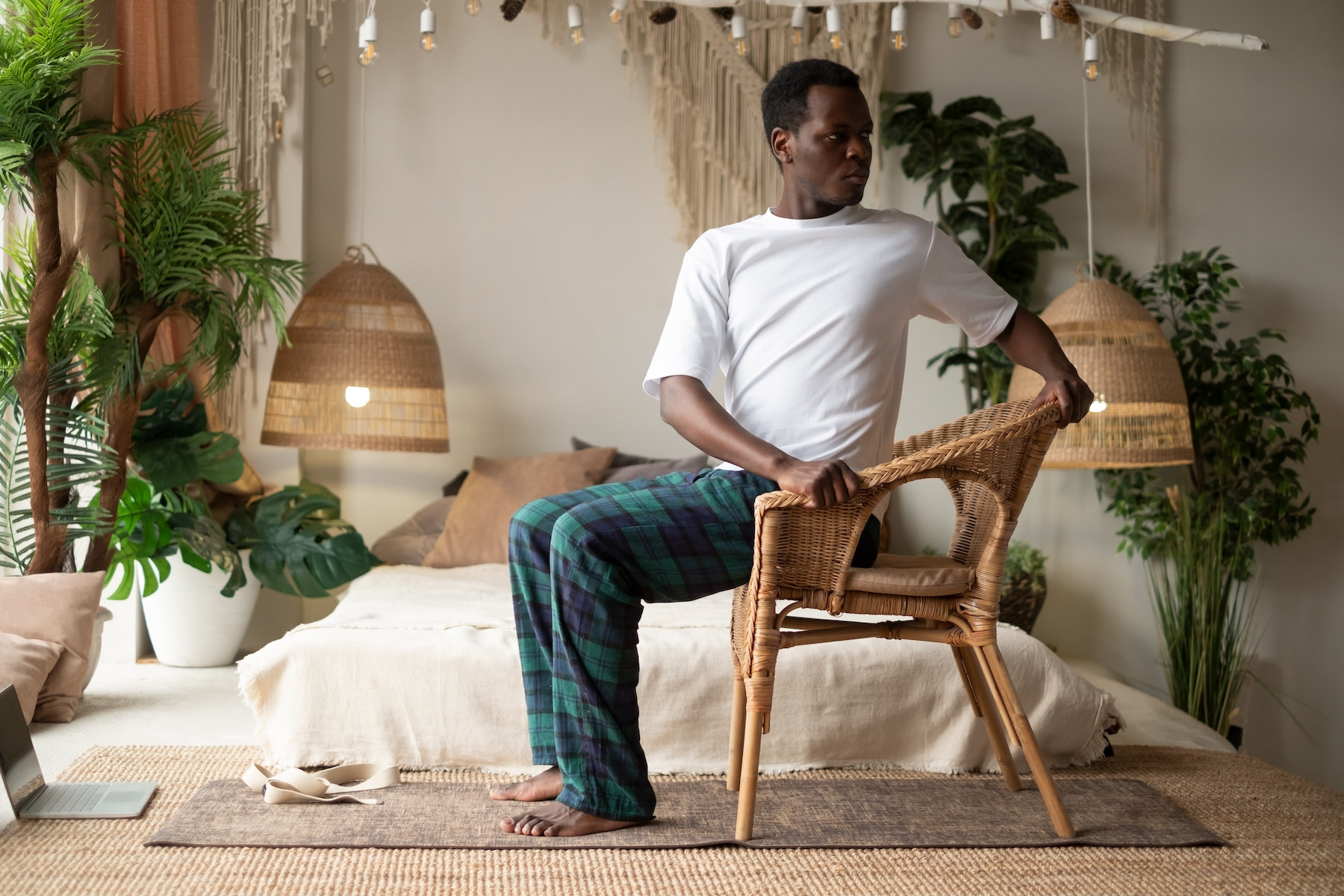 Man practices chair yoga