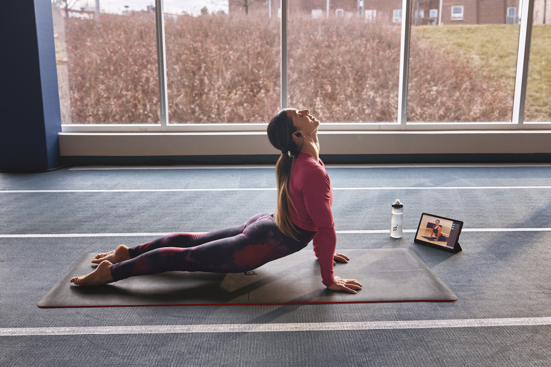 Peloton member taking a yoga class on the Peloton App