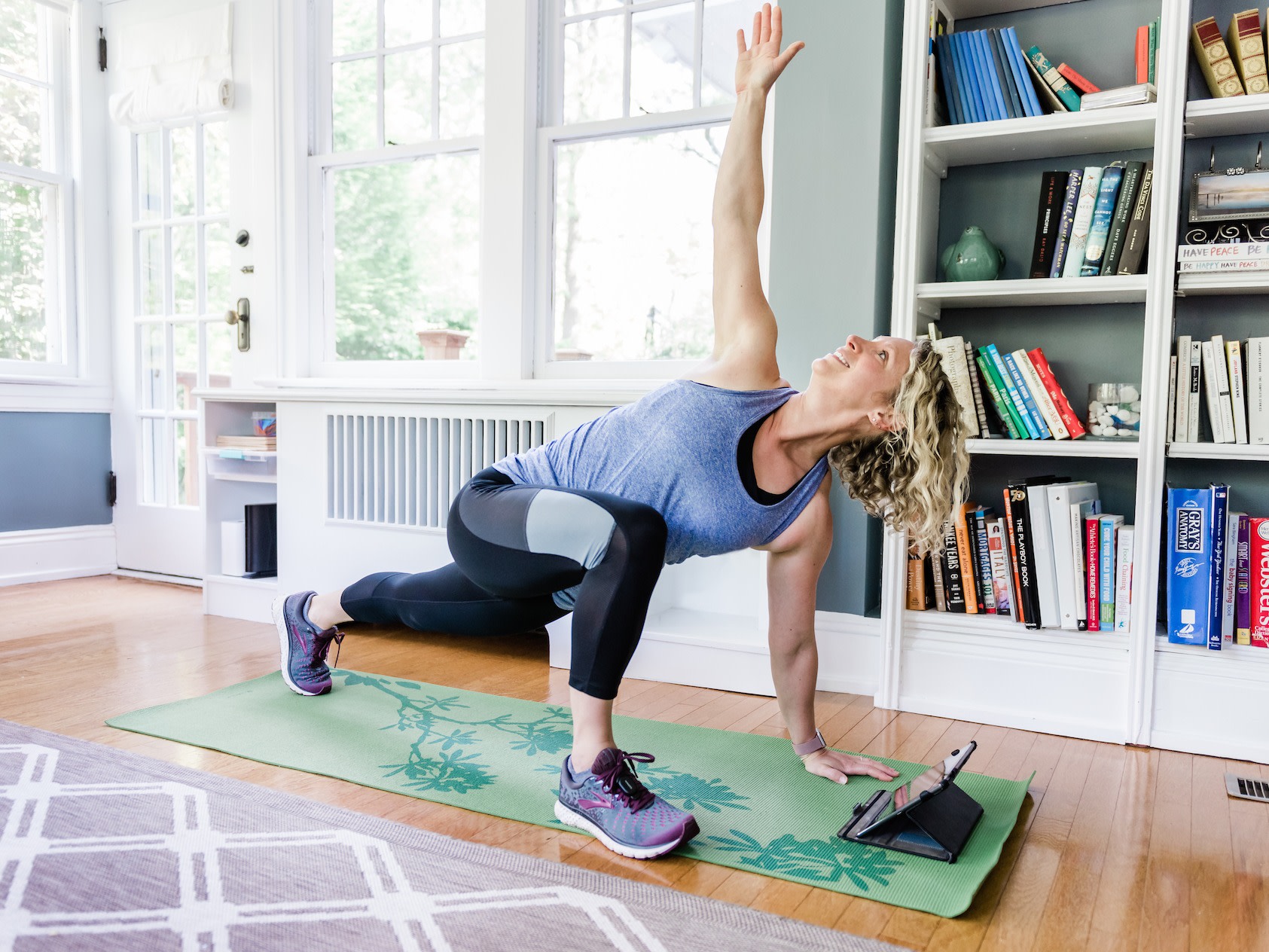 Image of a Peloton user doing World's Greatest Stretch (low lunge twist)