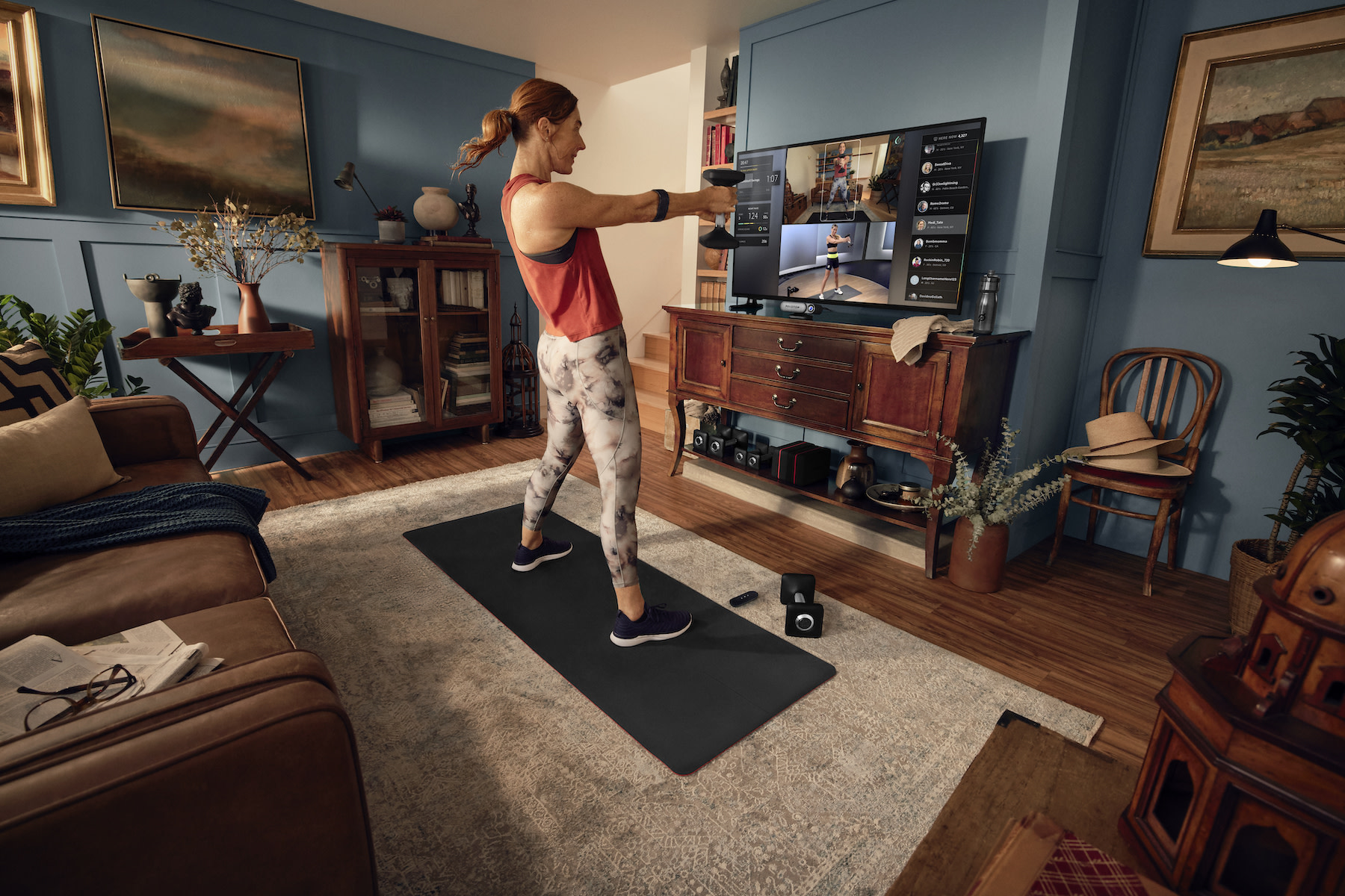 Woman uses Peloton Guide at home