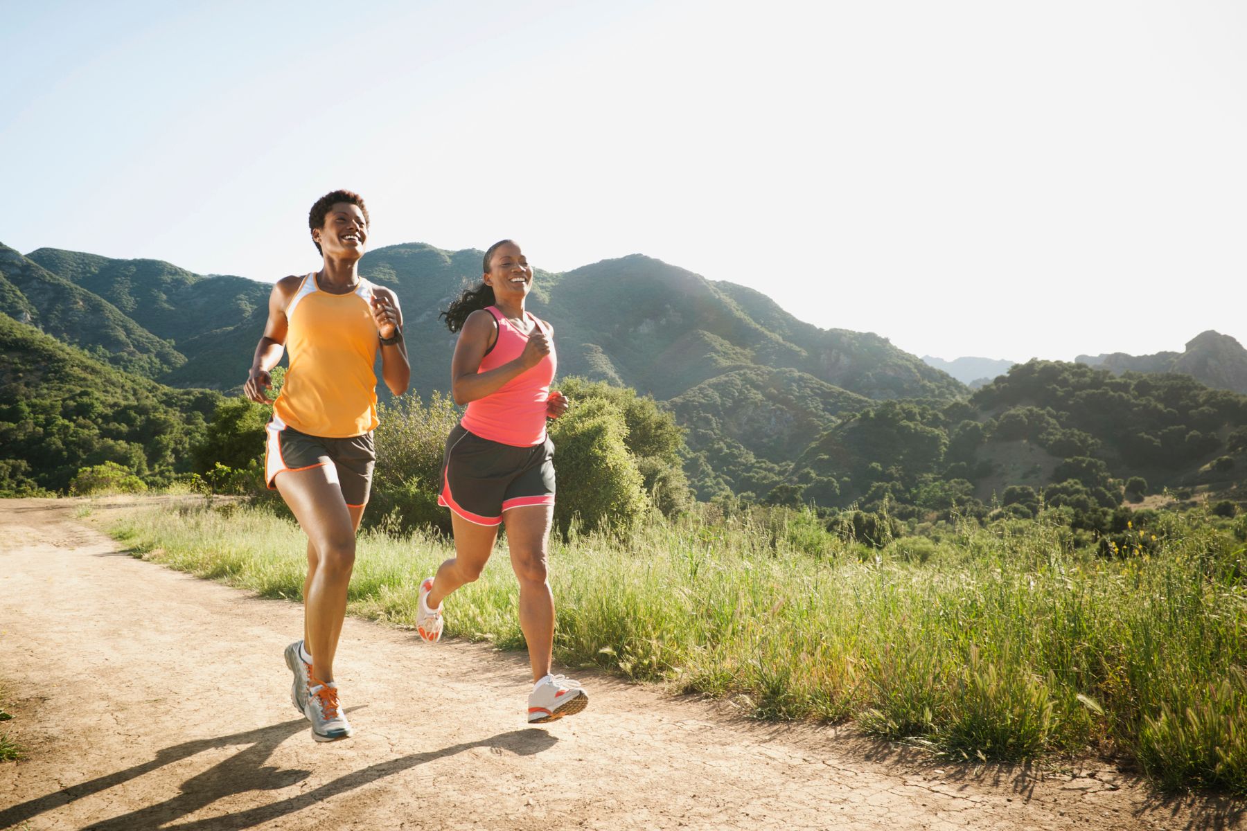 Two women running outside