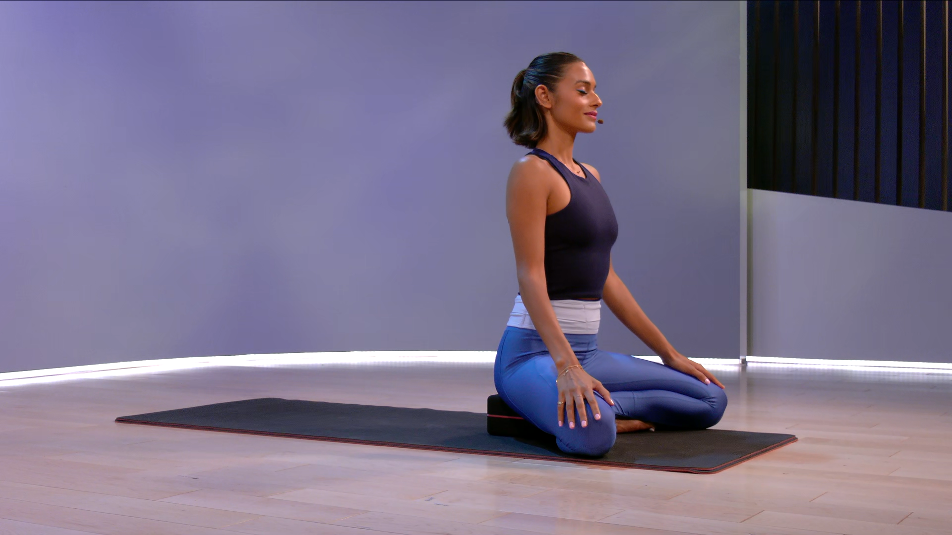 Aditi Shah sitting on mat during 15 min Morning Meditation