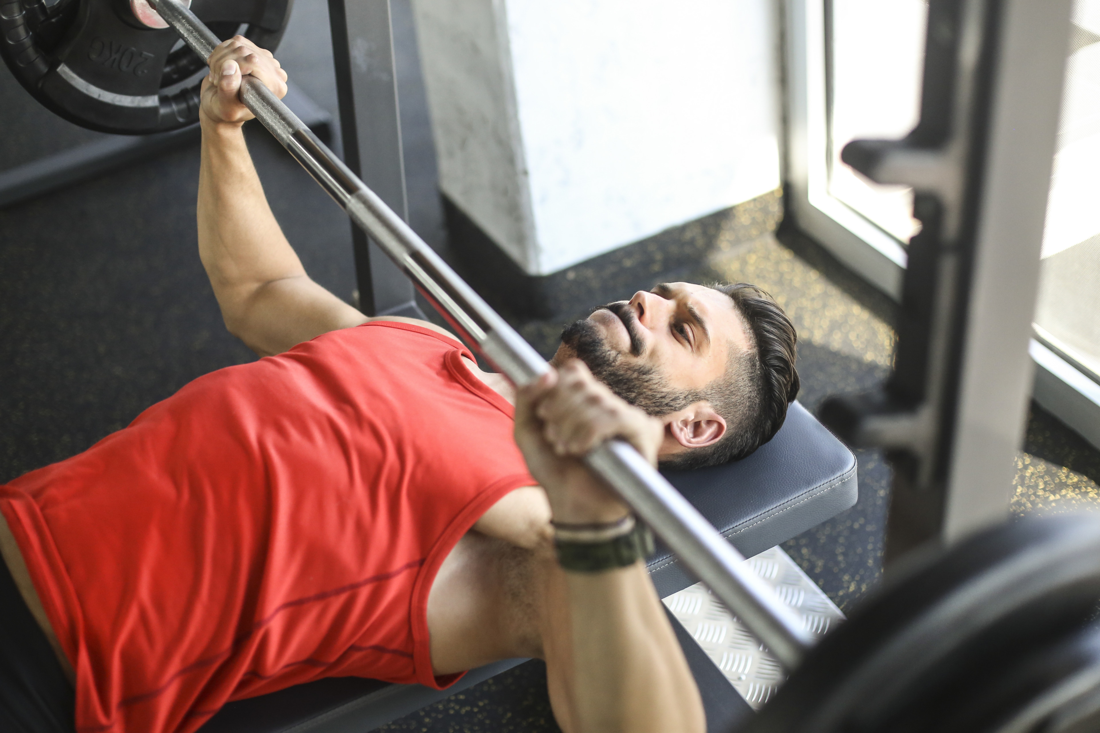 Man does a bench press exercise 