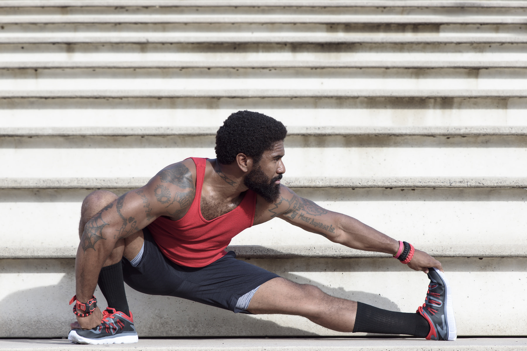 man stretching before a workout