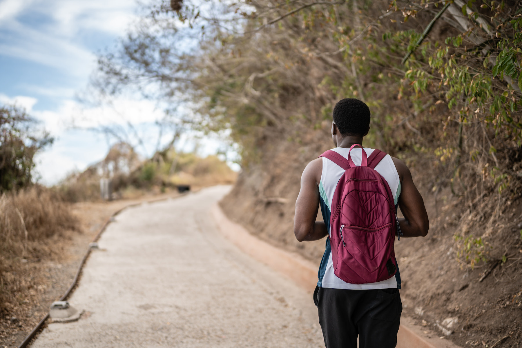 man walking with backpack