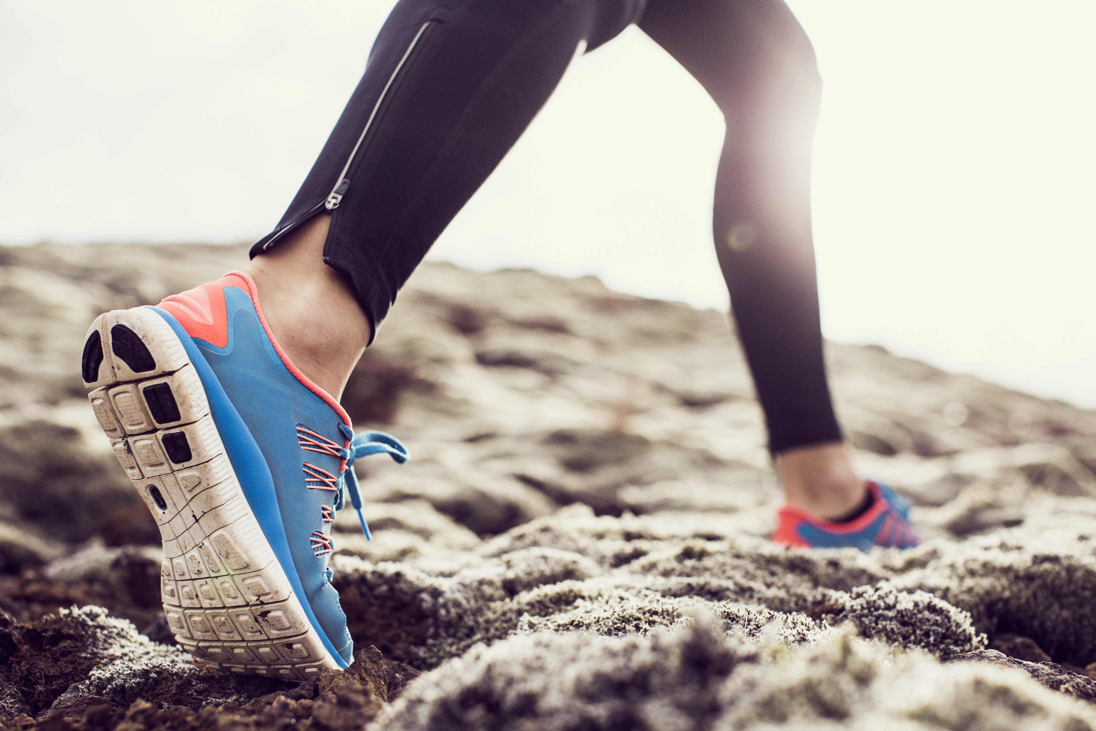 Close up of sneakers running outdoors