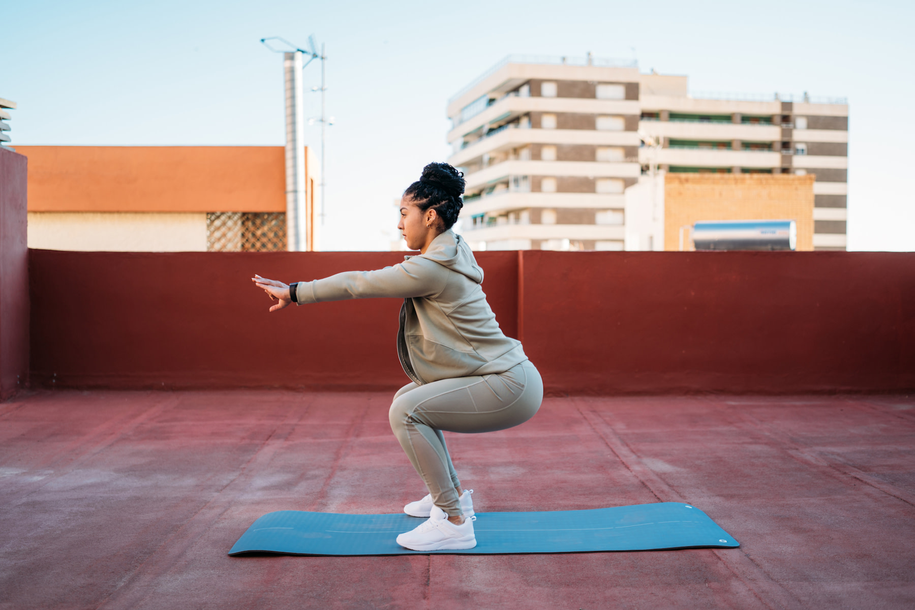 Woman does squat variations outside