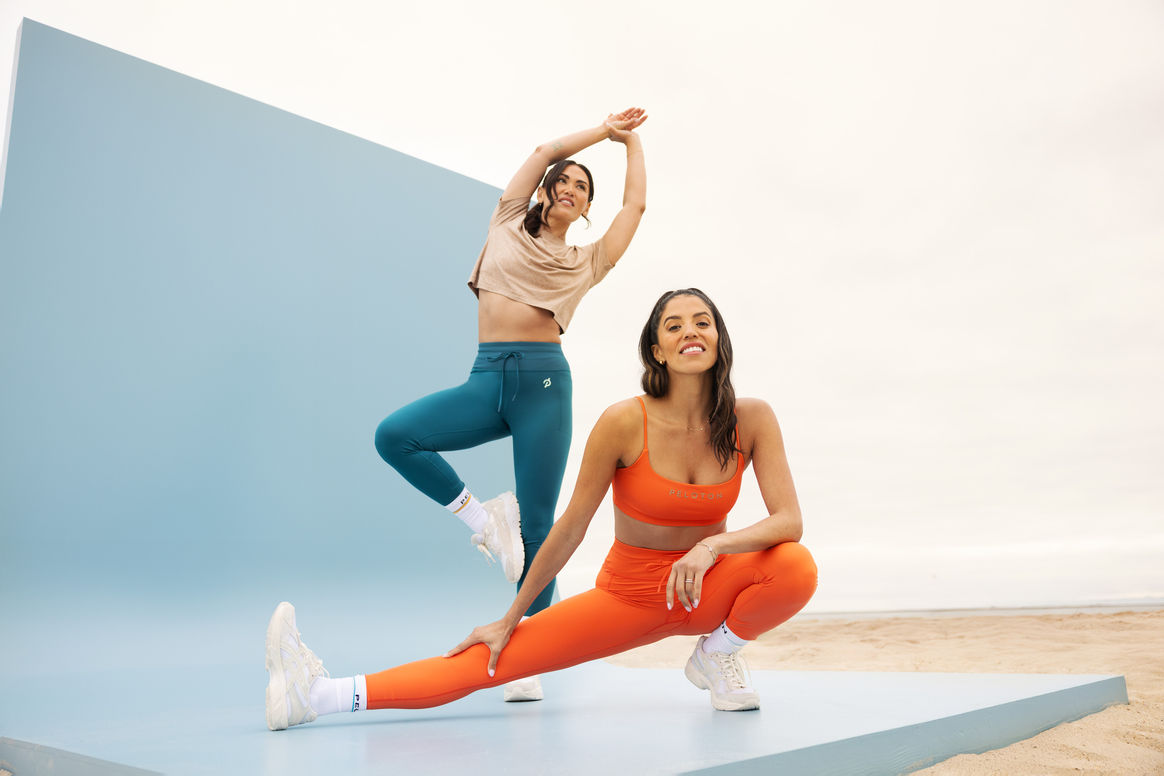 Hannah Corbin and Katie Wang wearing the Peloton Apparel x TravisMathew collection