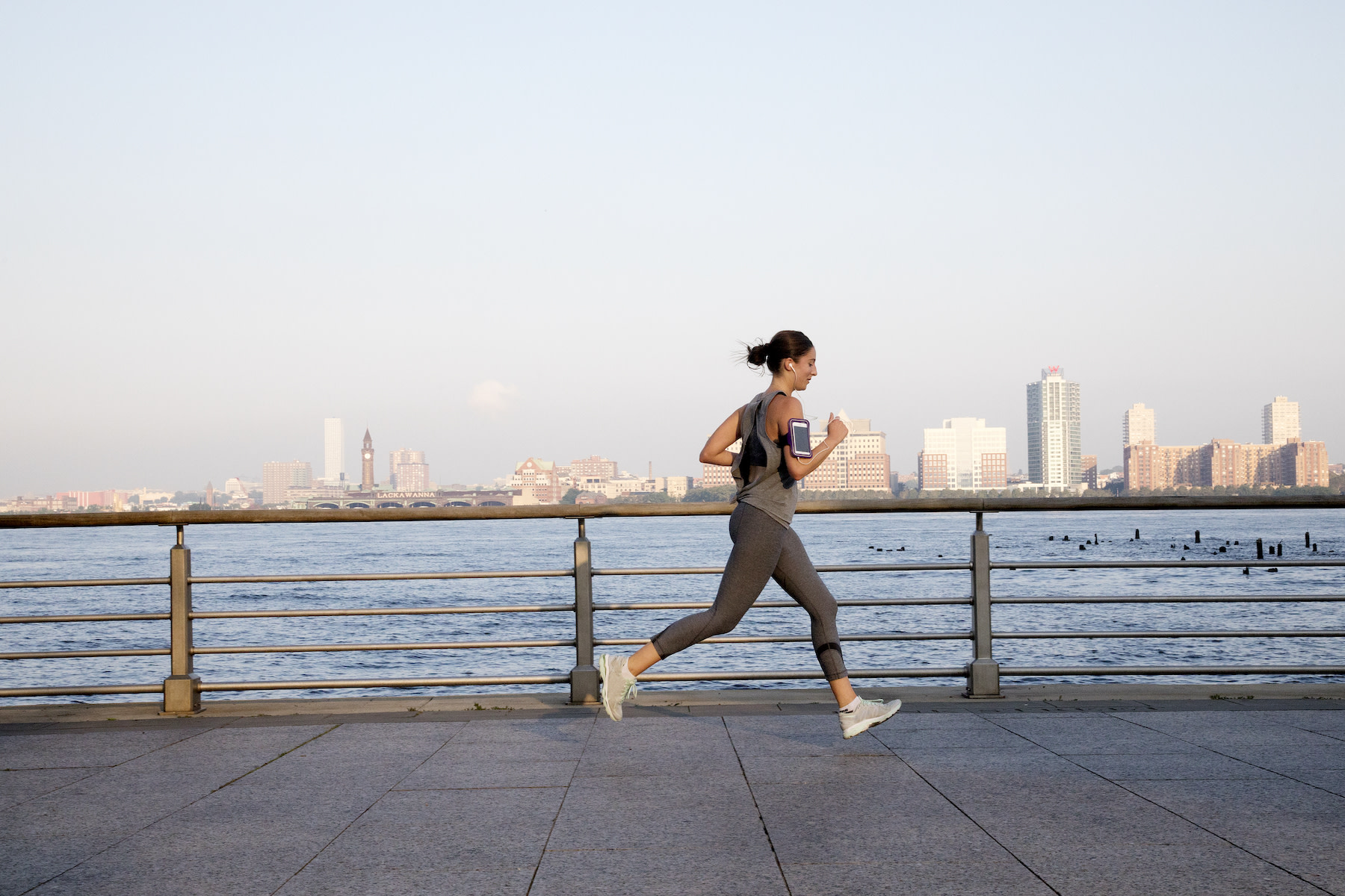 Woman running outside, the benefits of running every day