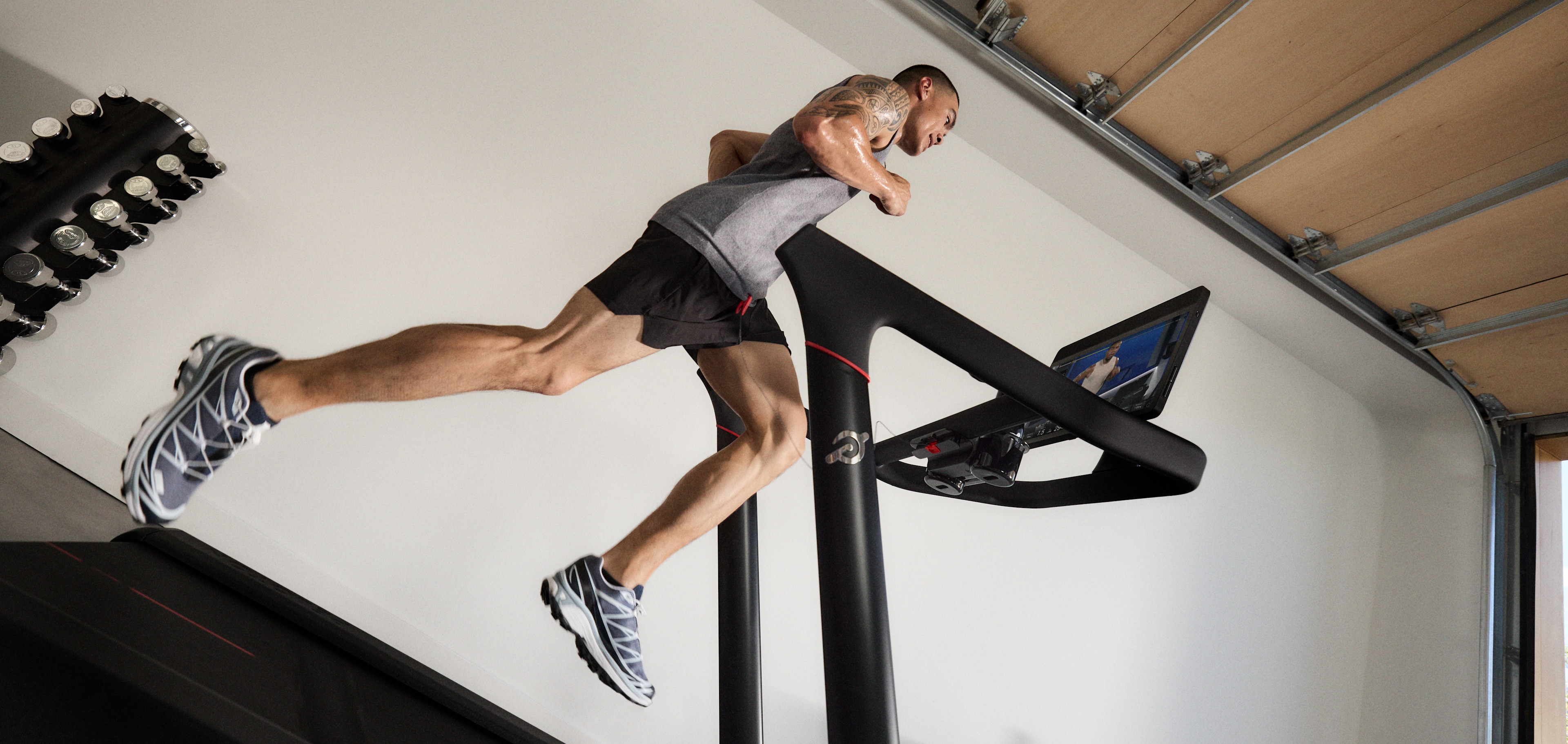 Man running on a Peloton Tread