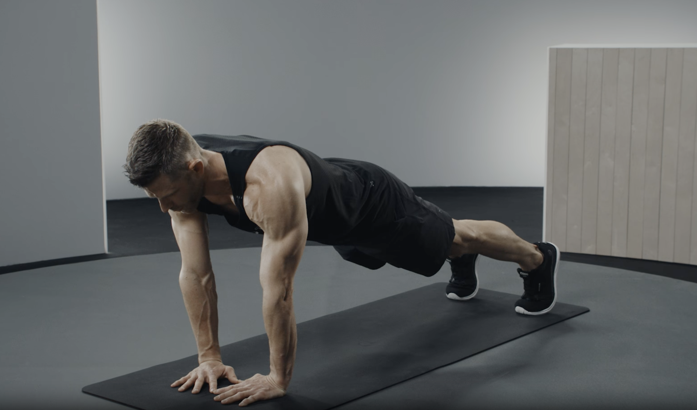 Andy Speer demonstrates a diamond push-up exercise