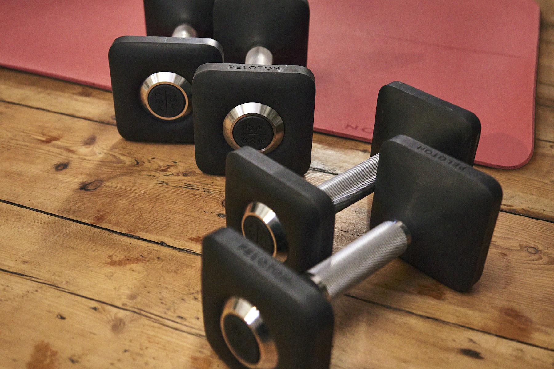 Two sets of dumbbells on the floor