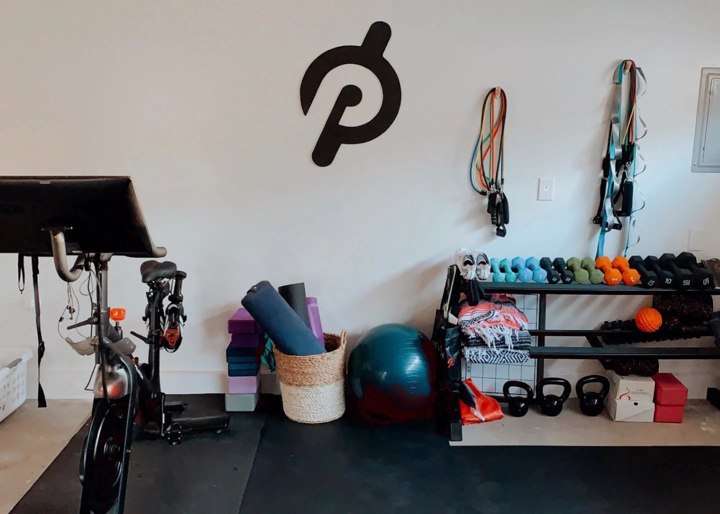 Peloton bike, yoga equipment and weights