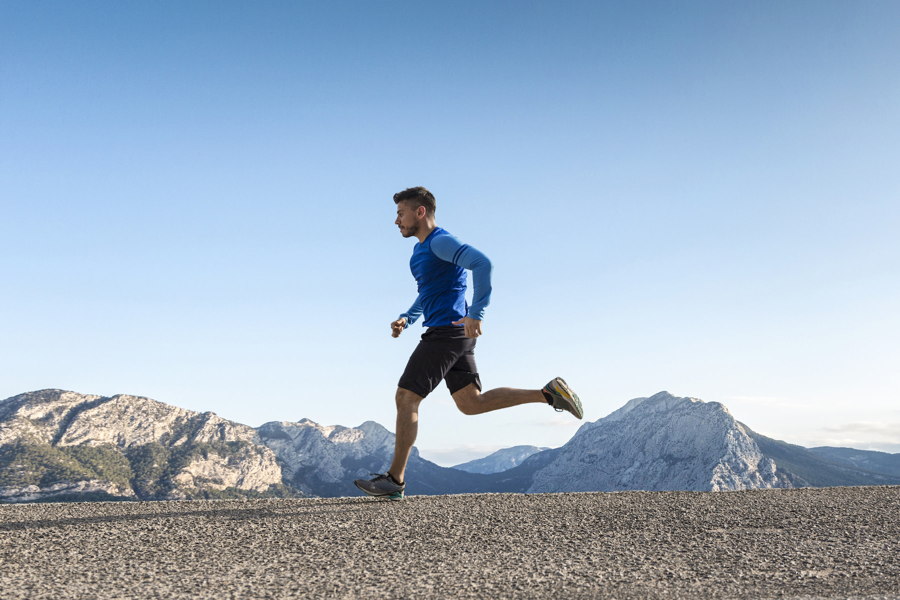 Man does a sprint workout outside