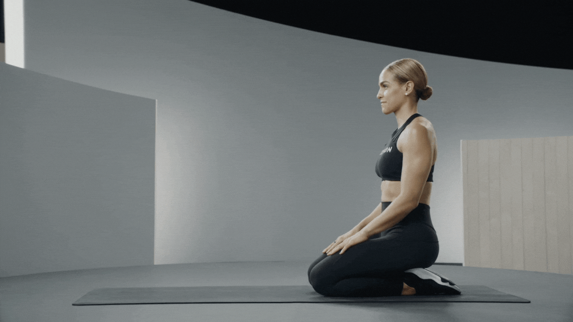 Peloton instructor Jess Sims demonstrates the forearm plank exercise with proper form