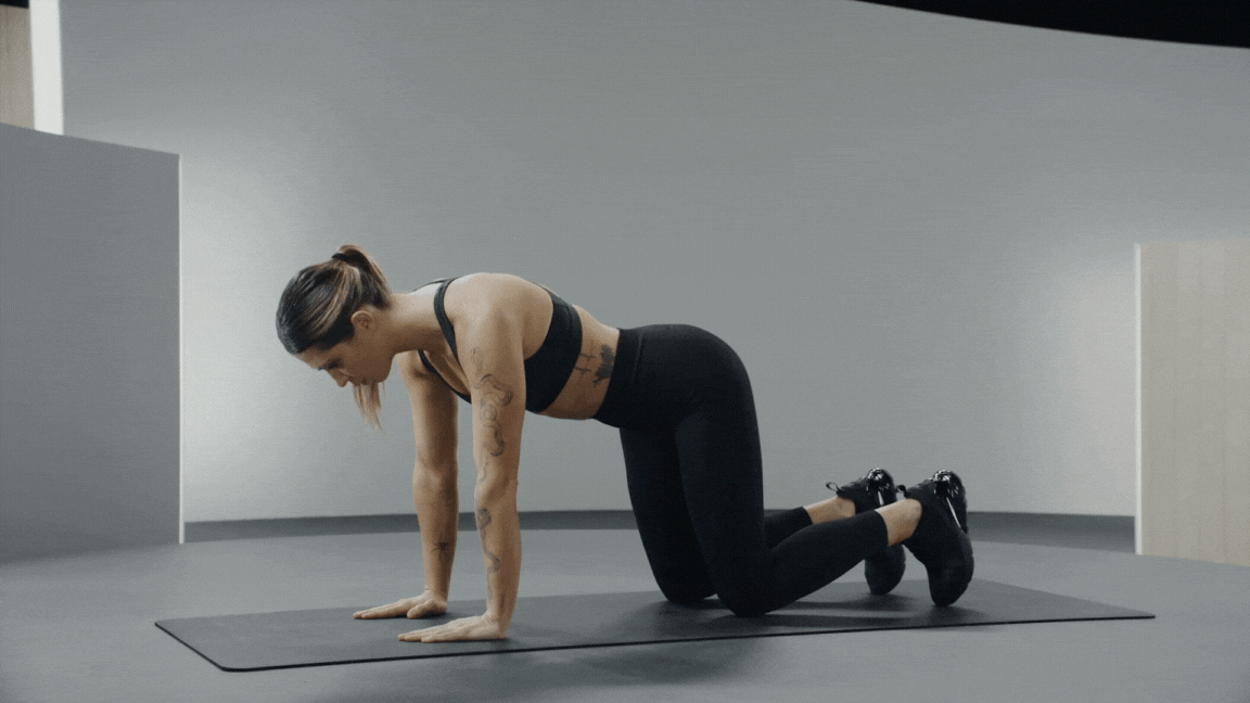 Selena Samuela demonstrates a donkey kick exercise 