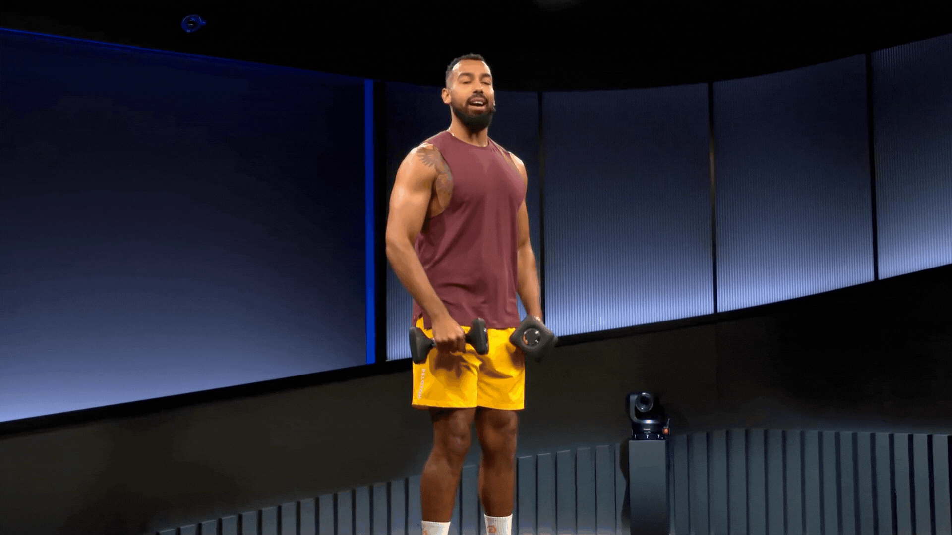 Man does a lateral raise with dumbbells, dumbbell shoulder exercises