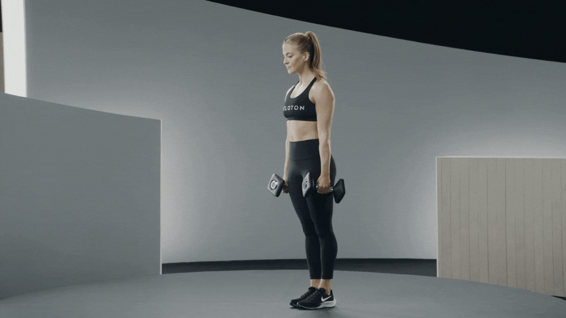 Peloton instructor Rebecca Kennedy demonstrates a dumbbell single-leg deadlift hamstring exercise with proper form