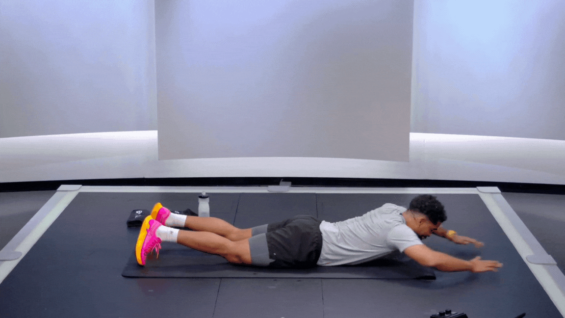 Peloton instructor Rad Lopez demonstrates the swimmer bodyweight exercise