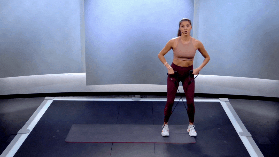 Peloton instructor Hannah Corbin demonstrates a banded walk.