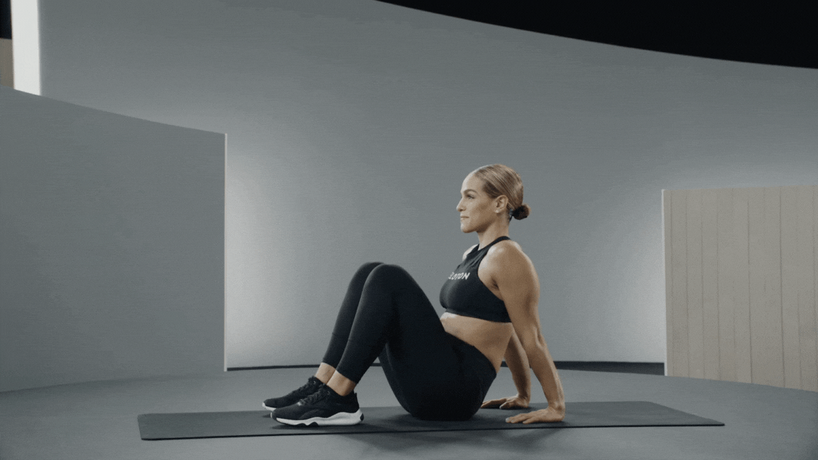 Woman performs a seated tricep dip