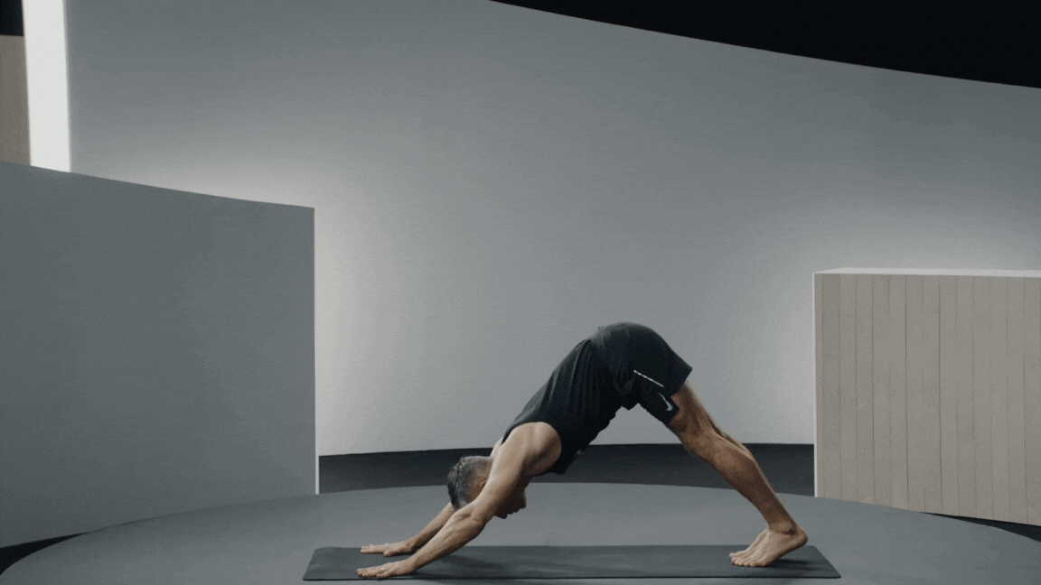 Peloton instructor Ross Rayburn demonstrates Warrior 1 yoga pose for flexibility.