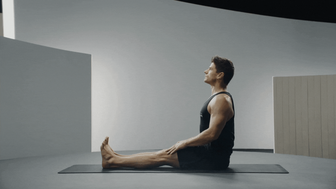 Peloton instructor Denis Morton demonstrates Easy Seat Pose.