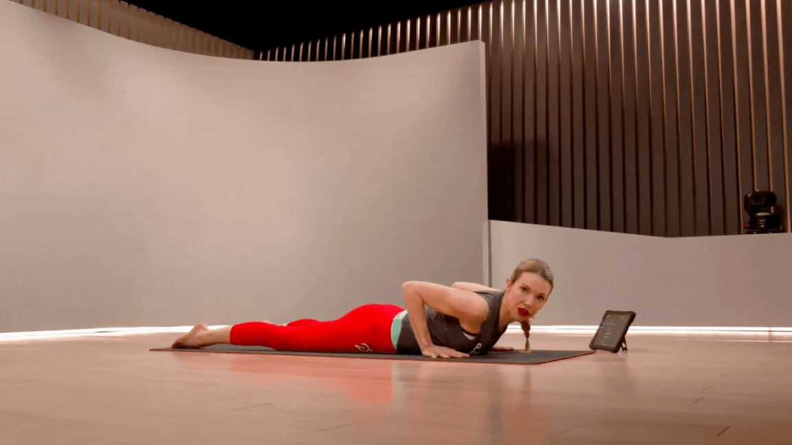 Peloton instructor Kristin McGee demonstrates yoga backbend Low Cobra or Baby Cobra during a Peloton yoga class