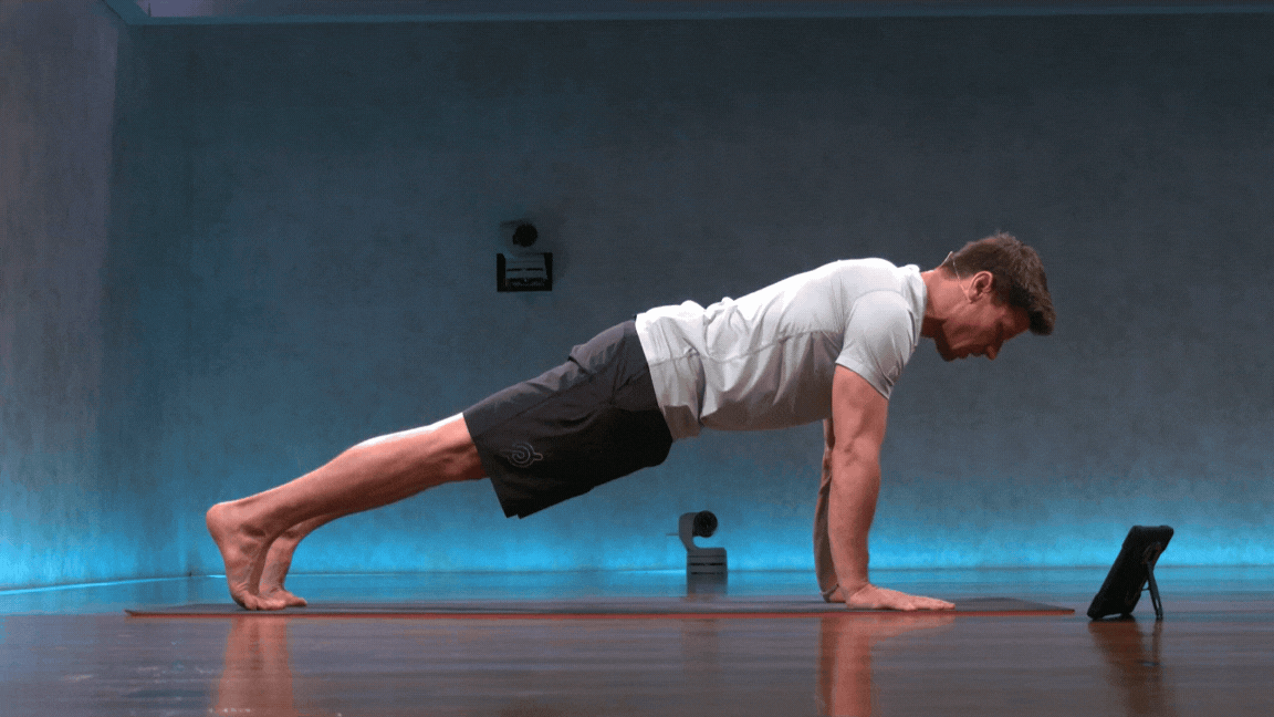 Peloton instructor Denis Morton demonstrating Chaturanga.