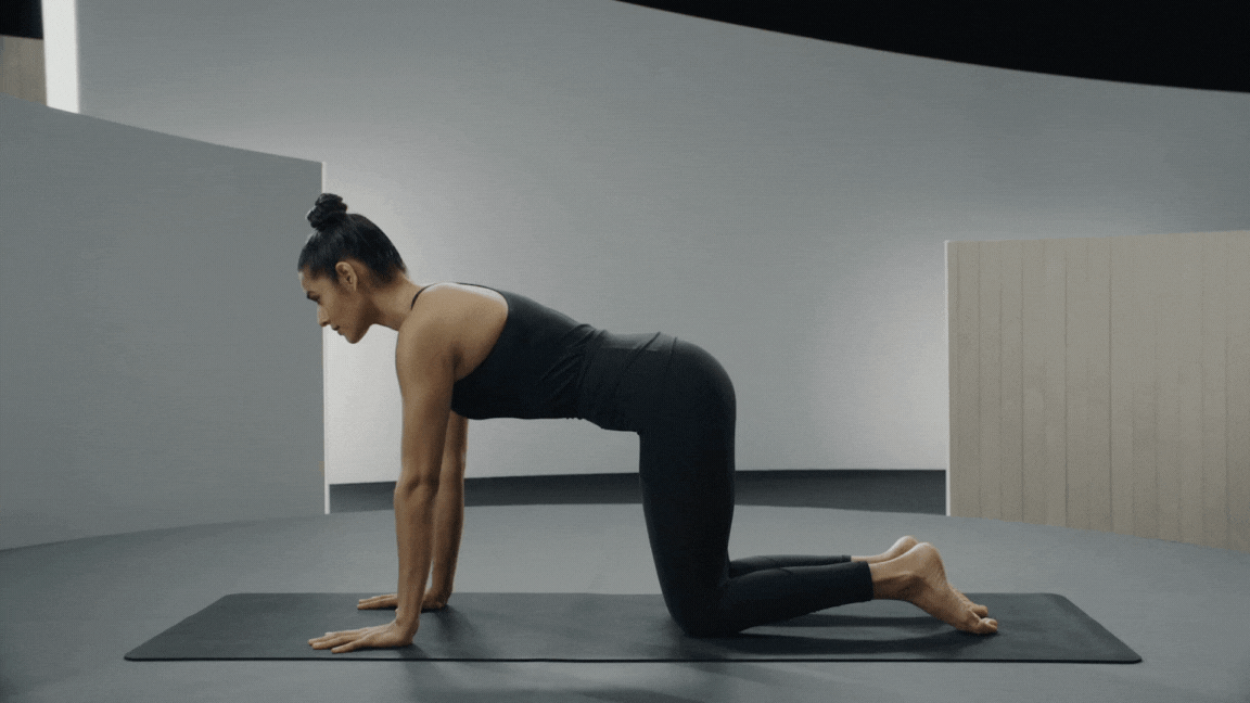 Peloton instructor Aditi Shah demonstrates Lizard Pose in yoga with proper form