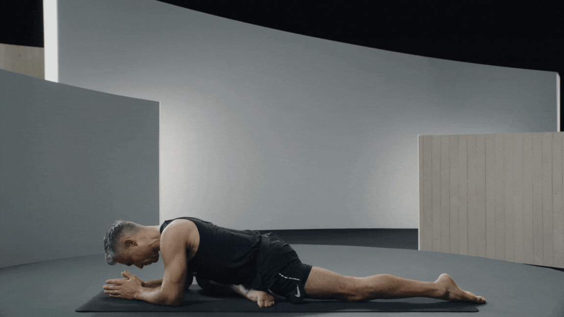 Peloton instructor Ross Rayburn demonstrates Mermaid Pose with proper form.