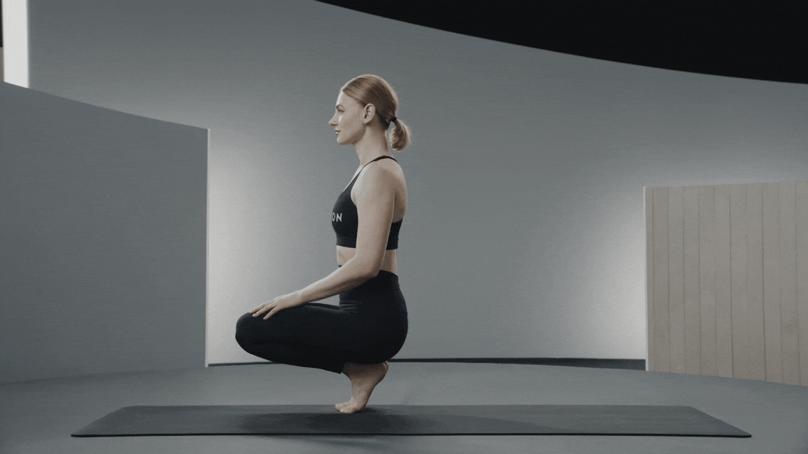 Woman demonstrating Side Crow Pose