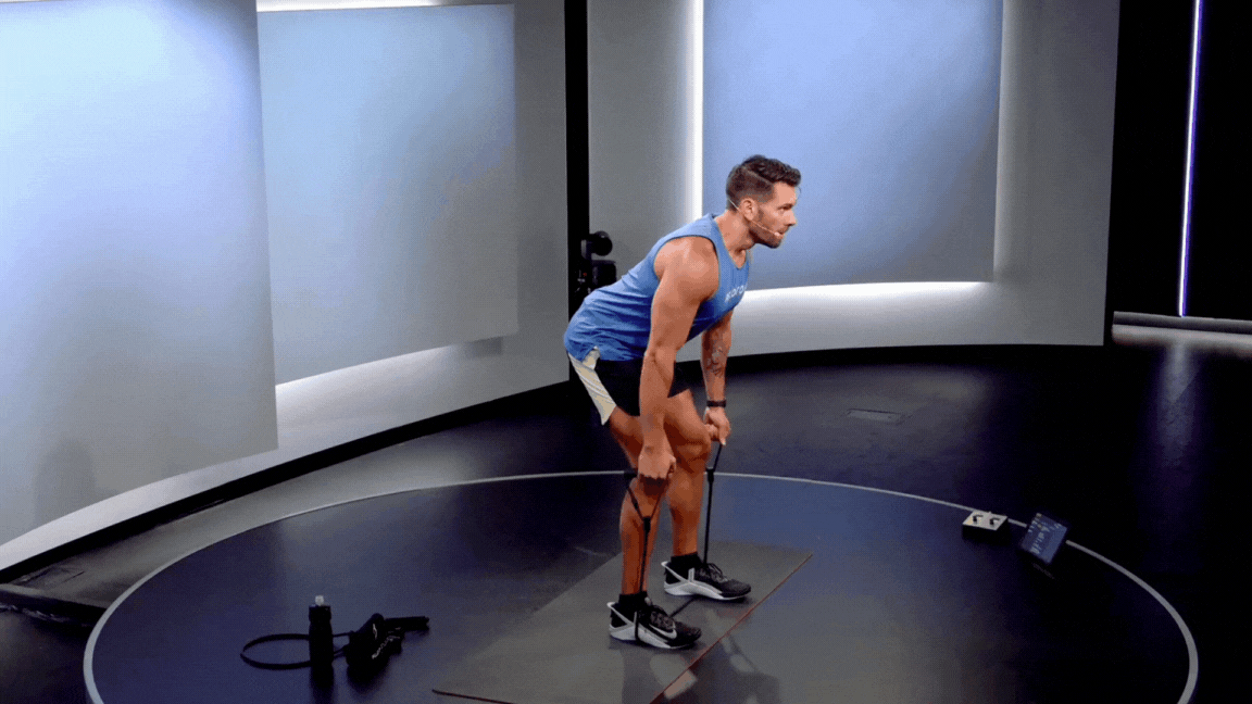 Peloton instructor Matty Maggiacomo demonstrates a resistance band bent-over row.