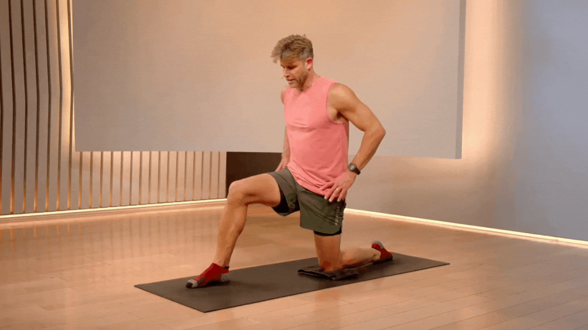 Peloton instructor Andy Speer demonstrates a hip flexor stretch as a cooldown exercise.