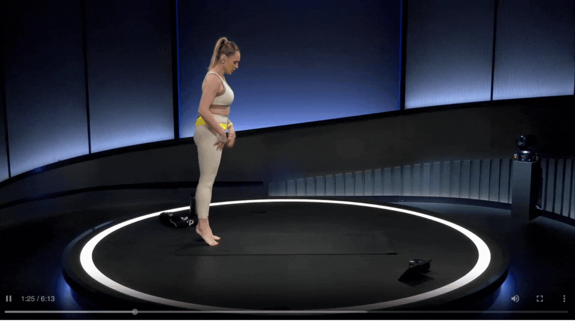 A Peloton instructor demonstrates the toe walks foot stretch during a mobility class.