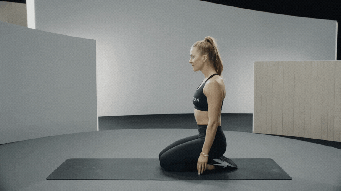 Peloton instructor Rebecca Kennedy demonstrating the superhuman exercise with proper form