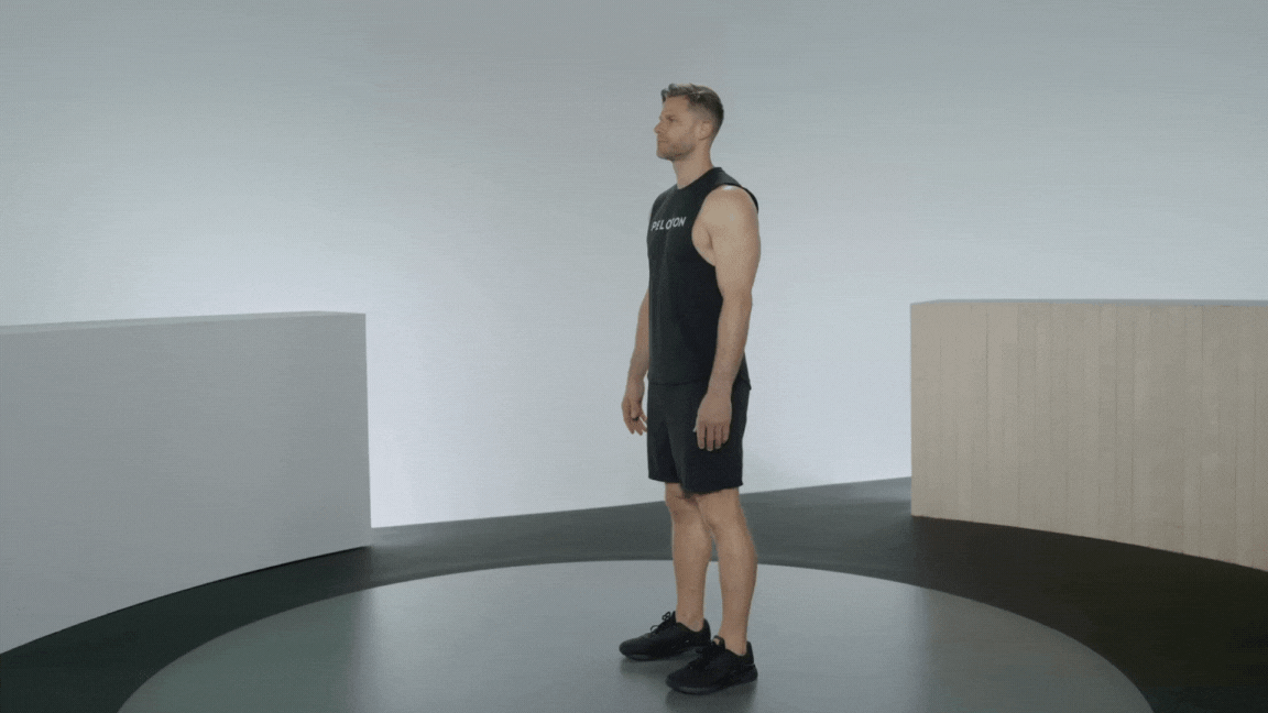 Peloton instructor Andy Speer demonstrates a standing calf raise with proper form.