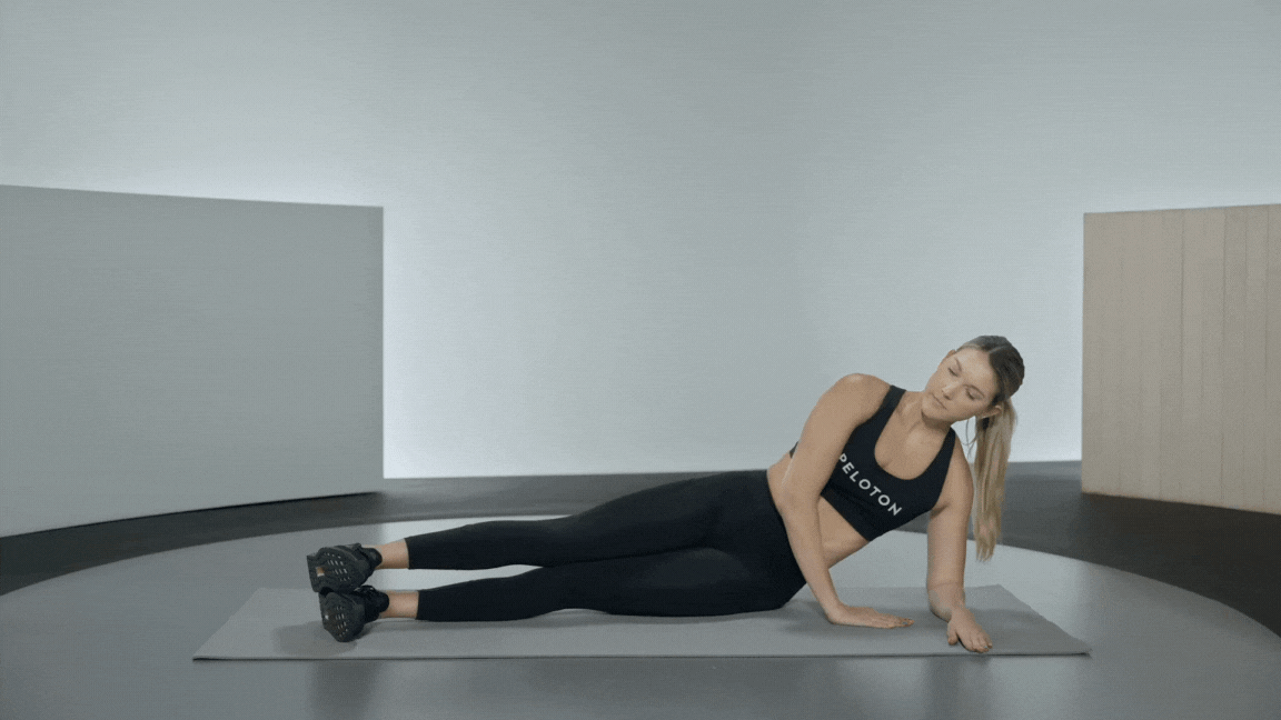 Peloton instructor Callie Gullickson demonstrates a side plank rotation