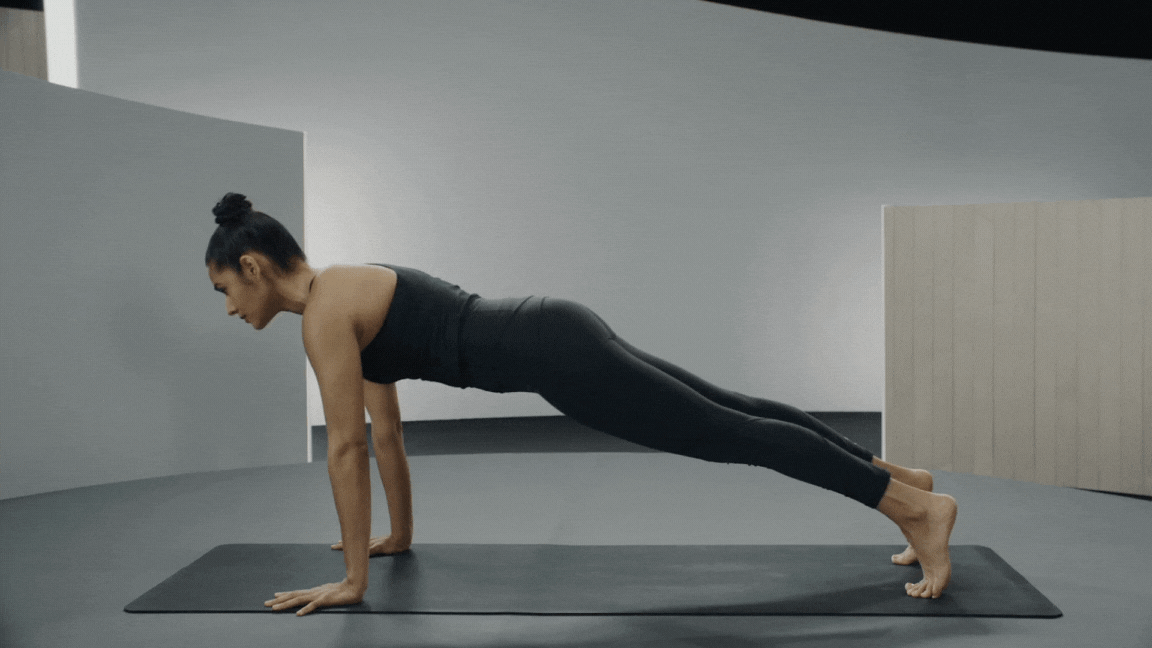 Peloton instructor Aditi Shah demonstrates Chaturanga Dandasana in yoga with proper form.