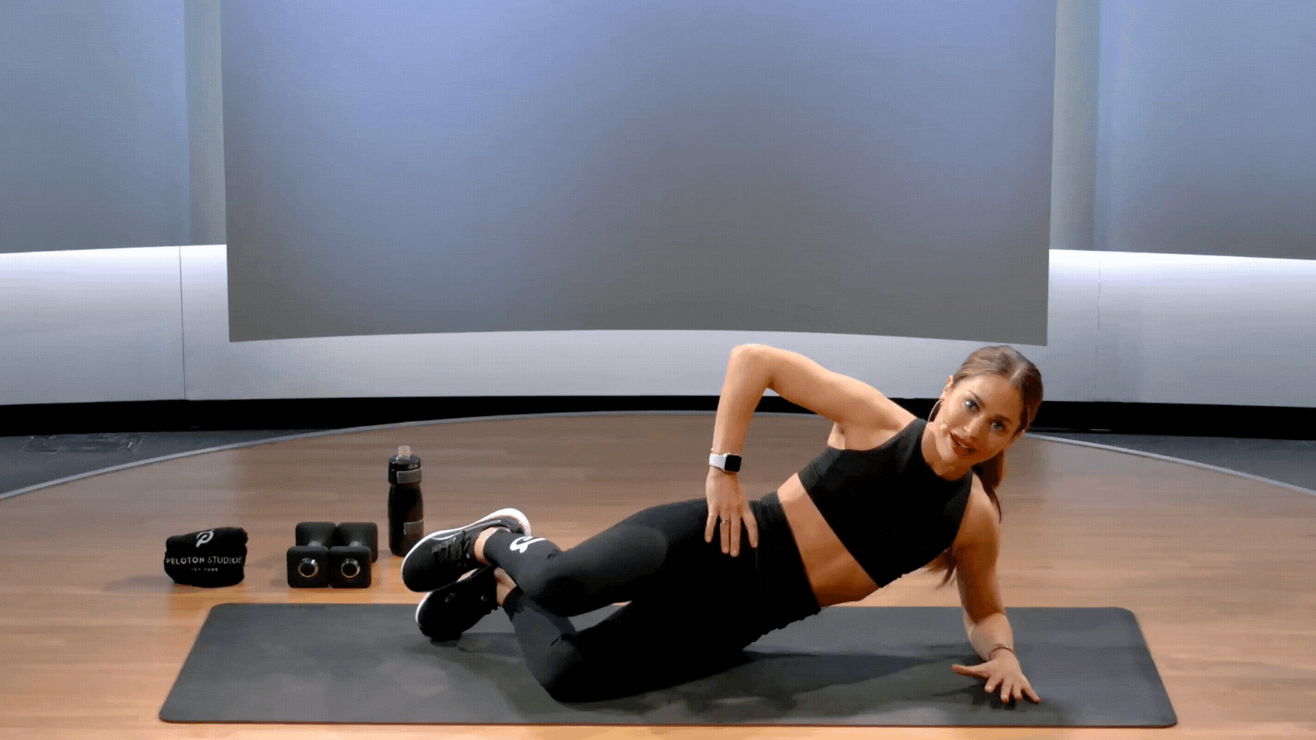 Woman does clamshell exercise, a gluteus minimus exercise