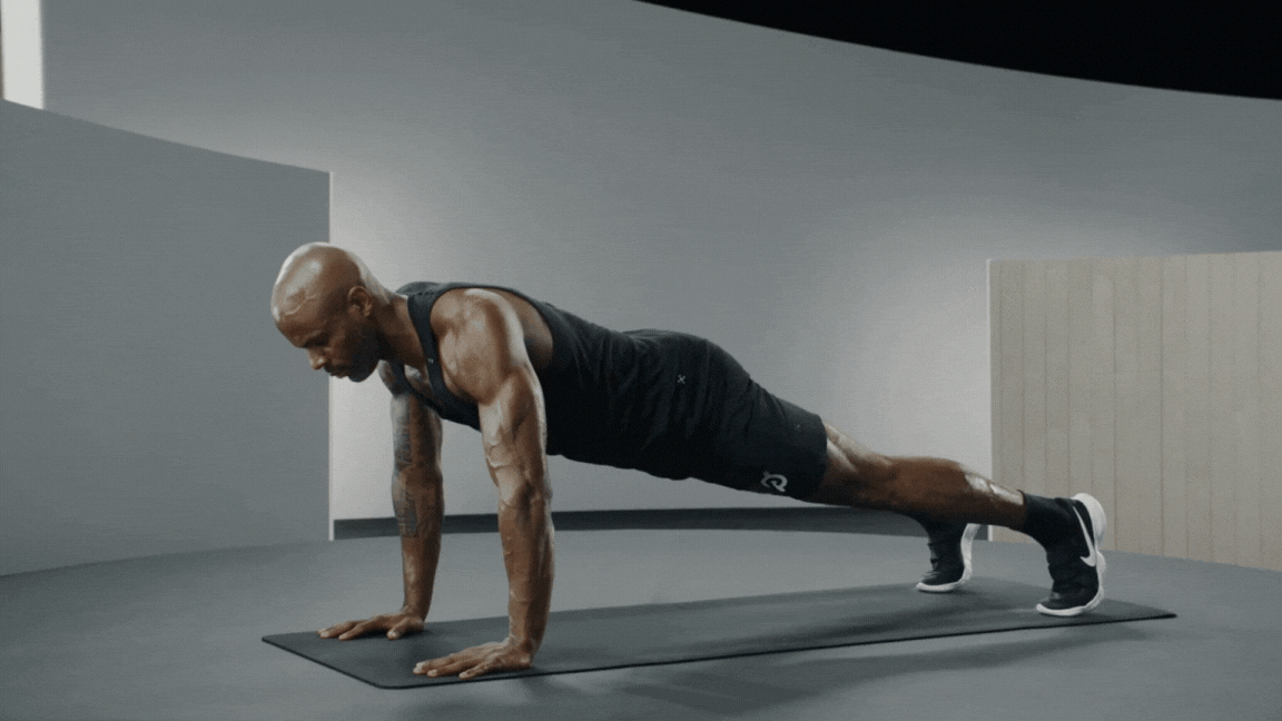 Peloton instructor Adrian Williams performing a push-up.