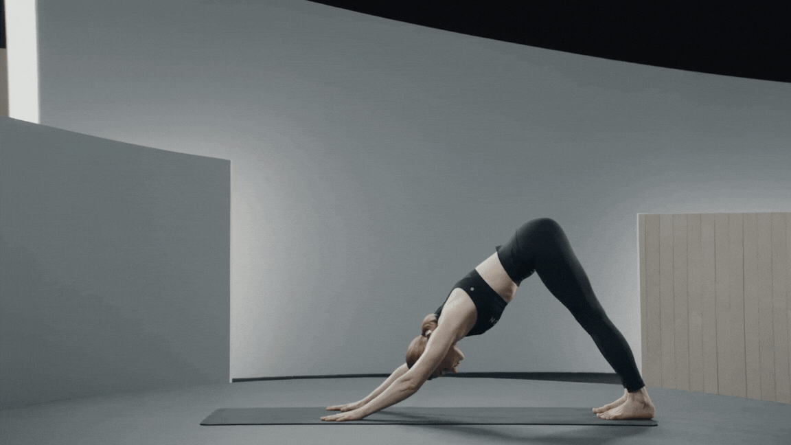 Peloton instructor Anna Greenberg demonstrates Warrior 3 pose in yoga for core strength