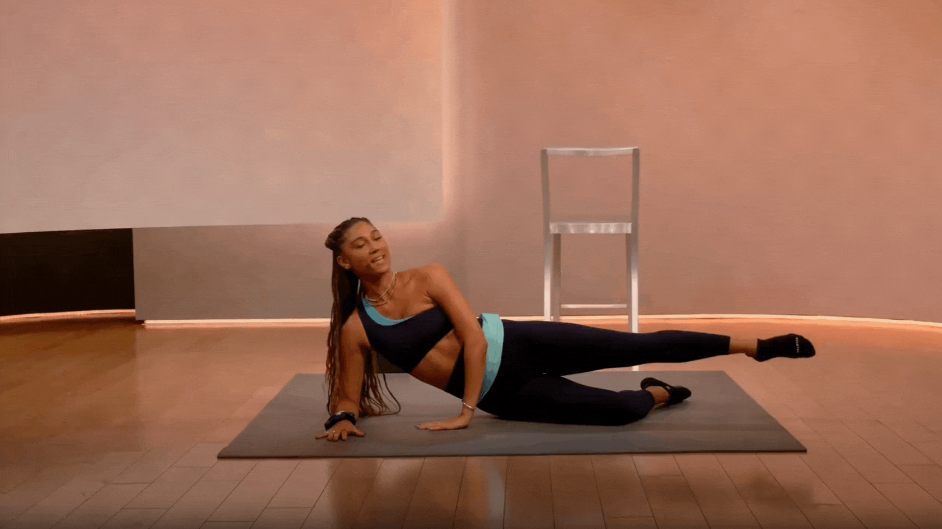 Ally Love doing leg lifts laying on her side