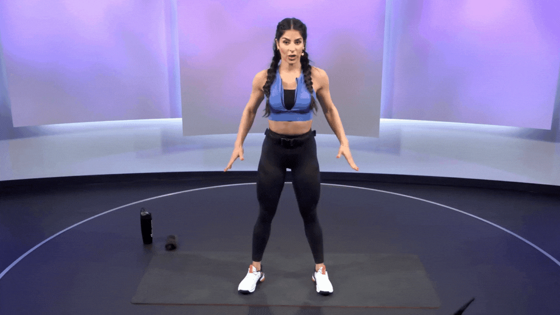 Woman demonstrates a bodyweight squat