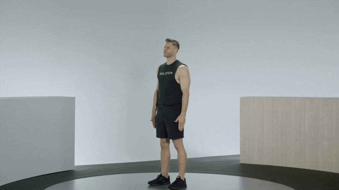 Peloton instructor Andy Speer demonstrates the shoulder CAR warm-up exercise.